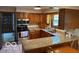 Traditional kitchen features wood cabinets, granite countertops, and stainless steel appliances at 7334 Fairwood Cir, Indianapolis, IN 46256