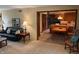 Open living room has a view into the kitchen and features a comfortable sofa and classic decor at 7334 Fairwood Cir, Indianapolis, IN 46256
