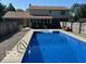 View of the backyard pool and the home's rear exterior, as seen from the pool at 7334 Fairwood Cir, Indianapolis, IN 46256