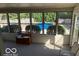 Sunroom with views of the backyard pool, offering a relaxing and bright space at 7334 Fairwood Cir, Indianapolis, IN 46256