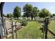 Fenced backyard with access to a serene lake and lush greenery at 7567 Muirfield Pl, Indianapolis, IN 46237