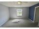 Bedroom featuring large window and ceiling fan, with view of outdoor scenery at 7567 Muirfield Pl, Indianapolis, IN 46237