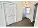 Entryway with carpeted floor, and view of the front door at 7567 Muirfield Pl, Indianapolis, IN 46237