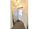 Entryway with carpeted floor, and open front door at 7567 Muirfield Pl, Indianapolis, IN 46237