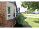 Charming, single-story home with blue siding, brick accents, well-maintained landscaping, and an attached garage at 7567 Muirfield Pl, Indianapolis, IN 46237
