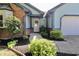 Charming, single-story home with blue siding, brick accents, well-maintained landscaping, and an attached garage at 7567 Muirfield Pl, Indianapolis, IN 46237