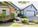 Charming, single-story home with blue siding, brick accents, well-maintained landscaping, and an attached garage at 7567 Muirfield Pl, Indianapolis, IN 46237