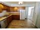 Kitchen with wood cabinets, stainless steel appliances, and neutral flooring at 7567 Muirfield Pl, Indianapolis, IN 46237