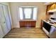 Bright kitchen features a bay window with storage, light-colored flooring, and stainless steel oven at 7567 Muirfield Pl, Indianapolis, IN 46237