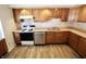 Kitchen featuring wood cabinets and stainless steel appliances at 7567 Muirfield Pl, Indianapolis, IN 46237