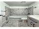 Well-maintained bathroom featuring white tile, modern fixtures, and a classic vanity, plus good lighting at 7719 Grandview Dr, Indianapolis, IN 46260