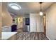 Stylish kitchen with a stainless steel refrigerator, and an elegant pendant light, creating a culinary haven at 7719 Grandview Dr, Indianapolis, IN 46260