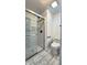 Clean bathroom showcasing a glass shower door, sleek fixtures, and well-maintained tile flooring at 7719 Grandview Dr, Indianapolis, IN 46260