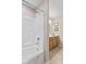 Functional bathroom with white shower-tub, wood vanity, and neutral flooring, offering a clean and practical space at 7850 King Post Dr, Indianapolis, IN 46237