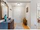 Inviting entryway with hardwood floors, mirror, console table, and neutral wall color at 7850 King Post Dr, Indianapolis, IN 46237