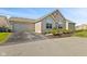 Charming exterior view of home with a well-maintained driveway and attached garage at 7850 King Post Dr, Indianapolis, IN 46237