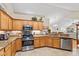 Well-equipped kitchen with granite countertops, stainless steel appliances, and ample cabinet space at 7850 King Post Dr, Indianapolis, IN 46237