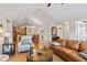 Open-concept living area with hardwood floors flowing into kitchen and dining space at 7850 King Post Dr, Indianapolis, IN 46237
