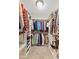 Well-organized walk-in closet featuring custom shelving, drawers, and plenty of hanging space at 7850 King Post Dr, Indianapolis, IN 46237