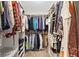 Spacious walk-in closet with custom shelving and ample storage space for an organized wardrobe at 7850 King Post Dr, Indianapolis, IN 46237