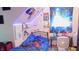 Well-lit bedroom decorated with LED lights, posters and a bed with a blue comforter at 7966 Chiltern Dr, Indianapolis, IN 46268