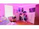 Fun bedroom with playful decor, vibrant lighting, and a cozy bed, creating a lively and inviting space at 7966 Chiltern Dr, Indianapolis, IN 46268