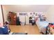 Bedroom with a neatly made bed, hardwood floors and multiple decorations and storage options at 7966 Chiltern Dr, Indianapolis, IN 46268