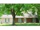 Charming single-Gathering home featuring a well-manicured lawn and mature trees offering ample shade at 7966 Chiltern Dr, Indianapolis, IN 46268