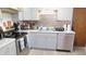 Modern kitchen equipped with stainless steel appliances, updated cabinets, and ample counter space for cooking and entertaining at 7966 Chiltern Dr, Indianapolis, IN 46268