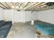 Unfinished basement with exposed ceiling and concrete floor at 806 N Gray St, Indianapolis, IN 46201