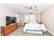 Cozy bedroom with ceiling fan, plush carpet, and natural light from the window at 806 N Gray St, Indianapolis, IN 46201