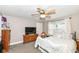 Cozy bedroom featuring a ceiling fan, modern TV, and comfortable furnishings at 806 N Gray St, Indianapolis, IN 46201