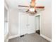 Bedroom features a ceiling fan and closets leading to another space at 806 N Gray St, Indianapolis, IN 46201