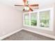 Bright bedroom with three windows, ceiling fan and neutral decor at 806 N Gray St, Indianapolis, IN 46201