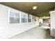 Inviting front porch showcases a neutral color palette and ample space for outdoor relaxation at 806 N Gray St, Indianapolis, IN 46201