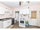 Functional kitchen offers ample counter space, neutral cabinets, and access to exterior at 806 N Gray St, Indianapolis, IN 46201