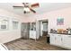 Bright kitchen with stainless steel refrigerator and plentiful storage cabinets at 806 N Gray St, Indianapolis, IN 46201