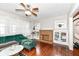 Inviting living room with hardwood floors, a cozy fireplace, and classic built-in shelving at 806 N Gray St, Indianapolis, IN 46201