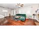 Spacious living room with hardwood floors, large windows, and comfortable seating arrangements at 806 N Gray St, Indianapolis, IN 46201