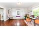 Bright living area features hardwood floors, large window, and space to dine or relax at 806 N Gray St, Indianapolis, IN 46201