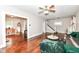 Open-concept living room offering hardwood floors, a staircase, and plenty of natural light at 806 N Gray St, Indianapolis, IN 46201