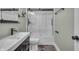 This bathroom boasts a modern vanity, sleek fixtures, and a shower-over-tub with glass enclosure at 8105 Allisonville Rd, Indianapolis, IN 46250