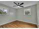 Bright bedroom features hardwood floors, neutral paint, and windows offering plenty of natural light at 8105 Allisonville Rd, Indianapolis, IN 46250