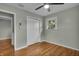 Inviting bedroom with hardwood floors, closet, and a window, creating a bright and airy space at 8105 Allisonville Rd, Indianapolis, IN 46250