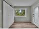 Bedroom features ample closet space and a view of the front yard at 8105 Allisonville Rd, Indianapolis, IN 46250