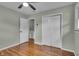 Comfortable bedroom featuring hardwood floors and a large closet, offering ample storage space at 8105 Allisonville Rd, Indianapolis, IN 46250