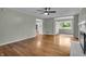 Inviting living room features hardwood floors, neutral paint, and large windows, with access to other rooms at 8105 Allisonville Rd, Indianapolis, IN 46250