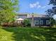 Backyard featuring a spacious deck, lush lawn, and a well-maintained exterior at 8394 Glen Highlands Dr, Indianapolis, IN 46236