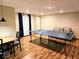 Basement game room with ping pong table and a comfortable seating area offer entertainment and relaxation at 8394 Glen Highlands Dr, Indianapolis, IN 46236