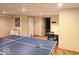 Basement game room with a ping pong table and a dining area offers recreation and dining space at 8394 Glen Highlands Dr, Indianapolis, IN 46236